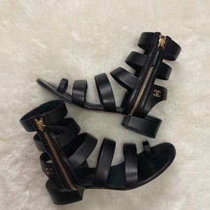 Authentic Chanel black heeled gladiator size 36, zipper closure and CC logo.